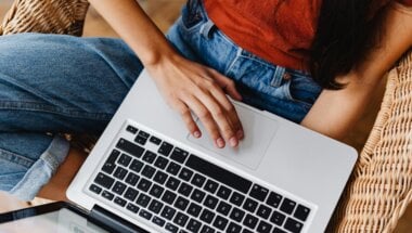 A woman using a laptop.