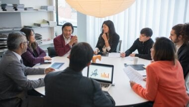 a group of colleagues discussing the best CRO agencies